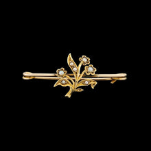 Load image into Gallery viewer, A yellow gold floral bar brooch with seed pearls, on a black background