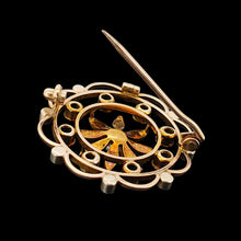 Load image into Gallery viewer, A circular brooch/pendant in yellow gold with peridots and pearls, with a flower to the centre