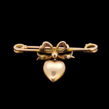 Load image into Gallery viewer, Antique 9ct Gold Heart and Bow Bar Brooch viewed from the front, on a black background