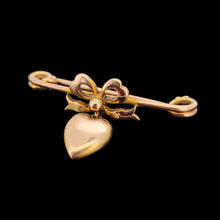 Load image into Gallery viewer, Antique 9ct Gold Heart and Bow Bar Brooch viewed from the side, on a black background