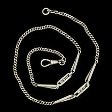 Load image into Gallery viewer, A silver curb and fancy link chain necklace with a lobster claw clasp, on a black background