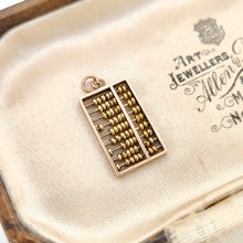 Load image into Gallery viewer, A yellow gold abacus charm, in an antique box