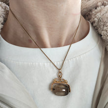 Load image into Gallery viewer, A spinning quartz fob pendant in yellow gold, modelled on a gold chain
