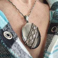 Load image into Gallery viewer, An oval silver locket pendant with acorn and oak leaf, modelled with a silver chain