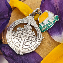 Load image into Gallery viewer, Vintage Sterling Silver Irish Fob Medal and Enamel Ireland Charm with flower petals and wood background
