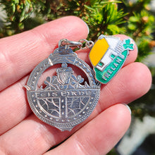 Load image into Gallery viewer, Vintage Sterling Silver Irish Fob Medal and Enamel Ireland Charm held in the hand