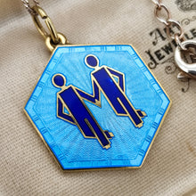 Load image into Gallery viewer, A hexagonal Gemini star sign pendant in blue enamel, with a chain, in an antique jewellery box