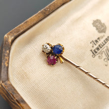 Load image into Gallery viewer, A ruby, sapphire and diamond clover shaped stick tie pin in gold, in an antique box