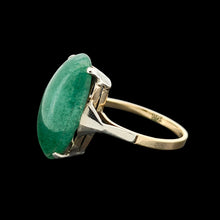 Load image into Gallery viewer, An oval nephrite jade ring in white and yellow gold, on a black background