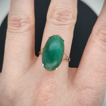 Load image into Gallery viewer, An oval nephrite jade ring in white and yellow gold, modelled on a hand
