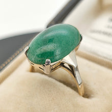 Load image into Gallery viewer, An oval nephrite jade ring in white and yellow gold, in a vintage ring box
