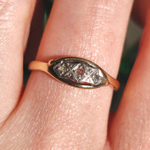 Load image into Gallery viewer, A three stone rose cut diamond ring in yellow gold and palladium, modelled on a hand