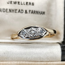 Load image into Gallery viewer, A three stone rose cut diamond ring in yellow gold and palladium, in a ring box