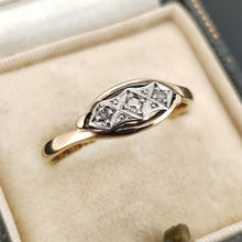 Load image into Gallery viewer, A three stone rose cut diamond ring in yellow gold and palladium, in a ring box