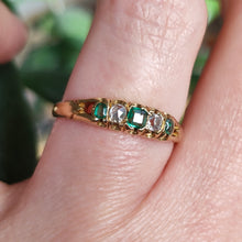 Load image into Gallery viewer, An emerald and diamond graduated five stone ring in yellow gold, modelled on a hand