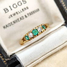 Load image into Gallery viewer, An emerald and diamond graduated five stone ring in yellow gold, in an antique ring box