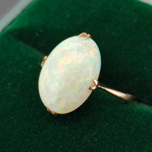 Load image into Gallery viewer, A single stone oval shaped, cabochon cut opal ring in rose gold, in a green ring box