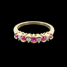 Load image into Gallery viewer, Vintage 9ct Yellow Gold Ruby and Diamond Scalloped Edge Ring viewed from the front, on a black background