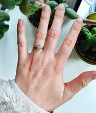 Load image into Gallery viewer, A diamond cluster crossover ring in 18 carat yellow gold and platinum, modelled on a hand