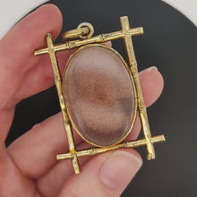 Load and play video in Gallery viewer, Large Antique Goldstone and Rock Crystal Locket video