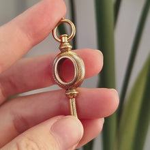 Load and play video in Gallery viewer, Antique Yellow Metal Watch Key Pendant