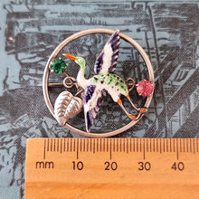 Load image into Gallery viewer, Art Deco Silver, Enamel & Paste Crane Bird Brooch next to ruler