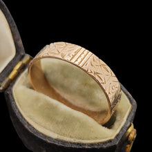 Load image into Gallery viewer, Gold ring with intricate design in an open antique ring box on a black background
