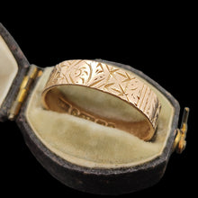 Load image into Gallery viewer, Gold ring with intricate design in an open antique ring box on a black background

