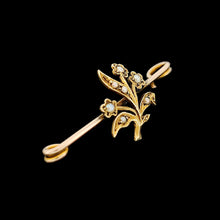 Load image into Gallery viewer, A yellow gold floral bar brooch with seed pearls, on a black background
