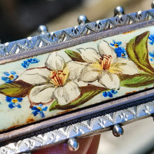 Load image into Gallery viewer, An oblong silver hobnail bead border brooch with an enamelled central plaque displaying flowers
