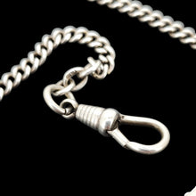 Load image into Gallery viewer, A silver curb link chain necklace with a lobster claw clasp, on a black background
