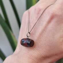 Load image into Gallery viewer, Antique Bloodstone Barrel Charm with Silver Chain in hand
