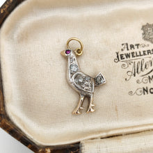 Load image into Gallery viewer, A diamond set bird charm in silver and yellow gold, with a ruby eye, in an antique box
