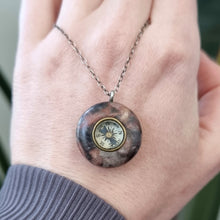 Load image into Gallery viewer, Antique Hardstone Compass Charm with Sterling Silver Chain in hand
