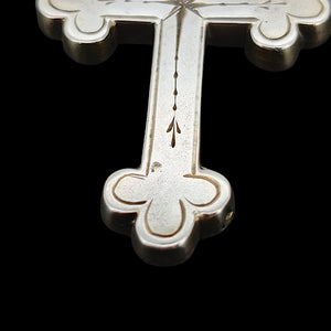 Victorian Sterling Silver Cross Pendant close-up of the bottom section, on a black background