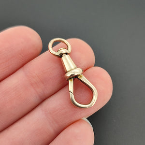 Antique 9ct Rose Gold Swivel Dog Clip in hand