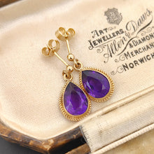 Load image into Gallery viewer, A pair of pear shaped amethyst drop earrings in yellow gold rope edge mounts, in an antique box
