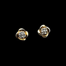 Load image into Gallery viewer, A pair of yellow gold diamond stud earrings, on a black background
