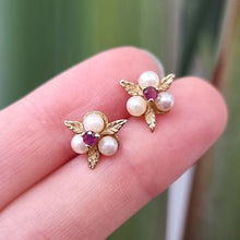Load image into Gallery viewer, Vintage 9ct Gold Ruby and Pearl Floral Stud Earrings in hand
