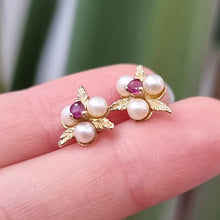Load image into Gallery viewer, Vintage 9ct Gold Ruby and Pearl Floral Stud Earrings in hand
