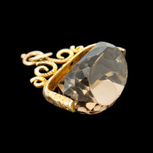 Load image into Gallery viewer, A spinning quartz fob pendant in yellow gold, on a black background
