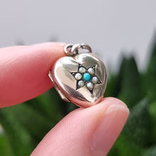 Load image into Gallery viewer, Antique 9ct Gold Turquoise and Seed Pearl Heart Locket in hand
