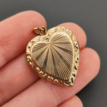 Load image into Gallery viewer, Art Deco 9ct Gold Back &amp; Front Heart Shaped Locket in hand
