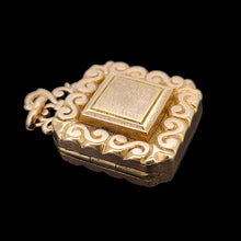 Load image into Gallery viewer, Antique Rolled Gold Ornate Locket Pendant shown from the side, on a black background
