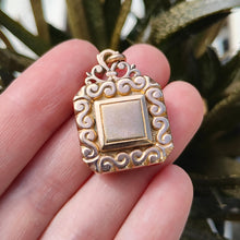 Load image into Gallery viewer, Antique Rolled Gold Ornate Locket Pendant held in the hand
