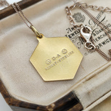 Load image into Gallery viewer, A hexagonal gilded pendant stamped D-A NORWAY-STERLING, in an antique jewellery box
