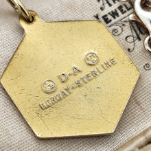 Load image into Gallery viewer, A hexagonal gilded pendant stamped D-A NORWAY-STERLING, in an antique jewellery box
