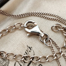 Load image into Gallery viewer, A silver chain with a lobster clasp, in an antique jewellery box
