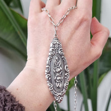 Load image into Gallery viewer, Antique Sterling Silver Floral Pendant with Sterling Silver Chain in hand
