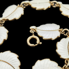 Load image into Gallery viewer, A white enamel leaf necklace in silver gilt, close-up of the bolt ring clasp
